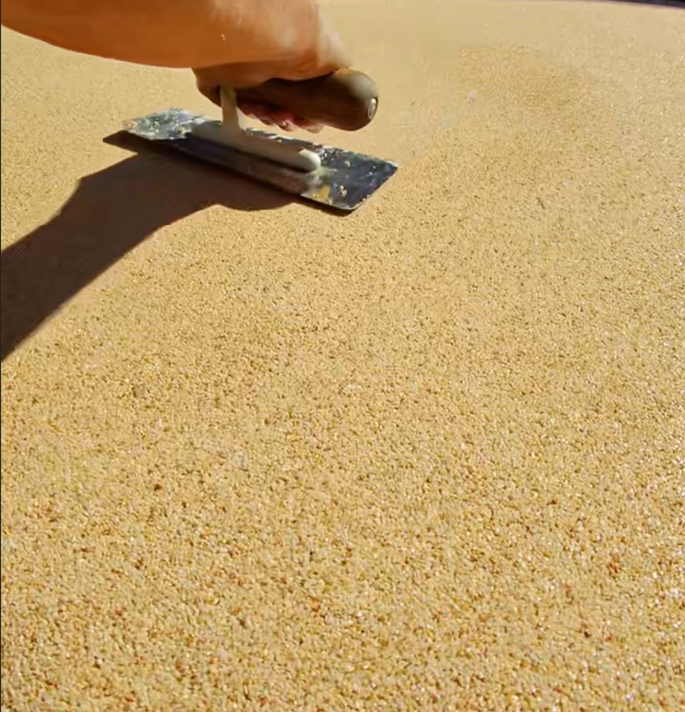 Installer troweling resin bound paving